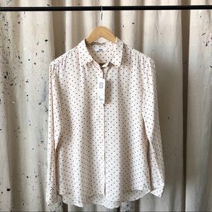 Polka dot blouse.